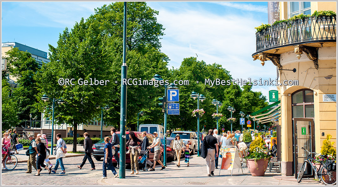 Esplanade Park and bandstand. Corner of Unioninkatu Street and North Esplanade hosts the Helsinki Tourist Info spot.